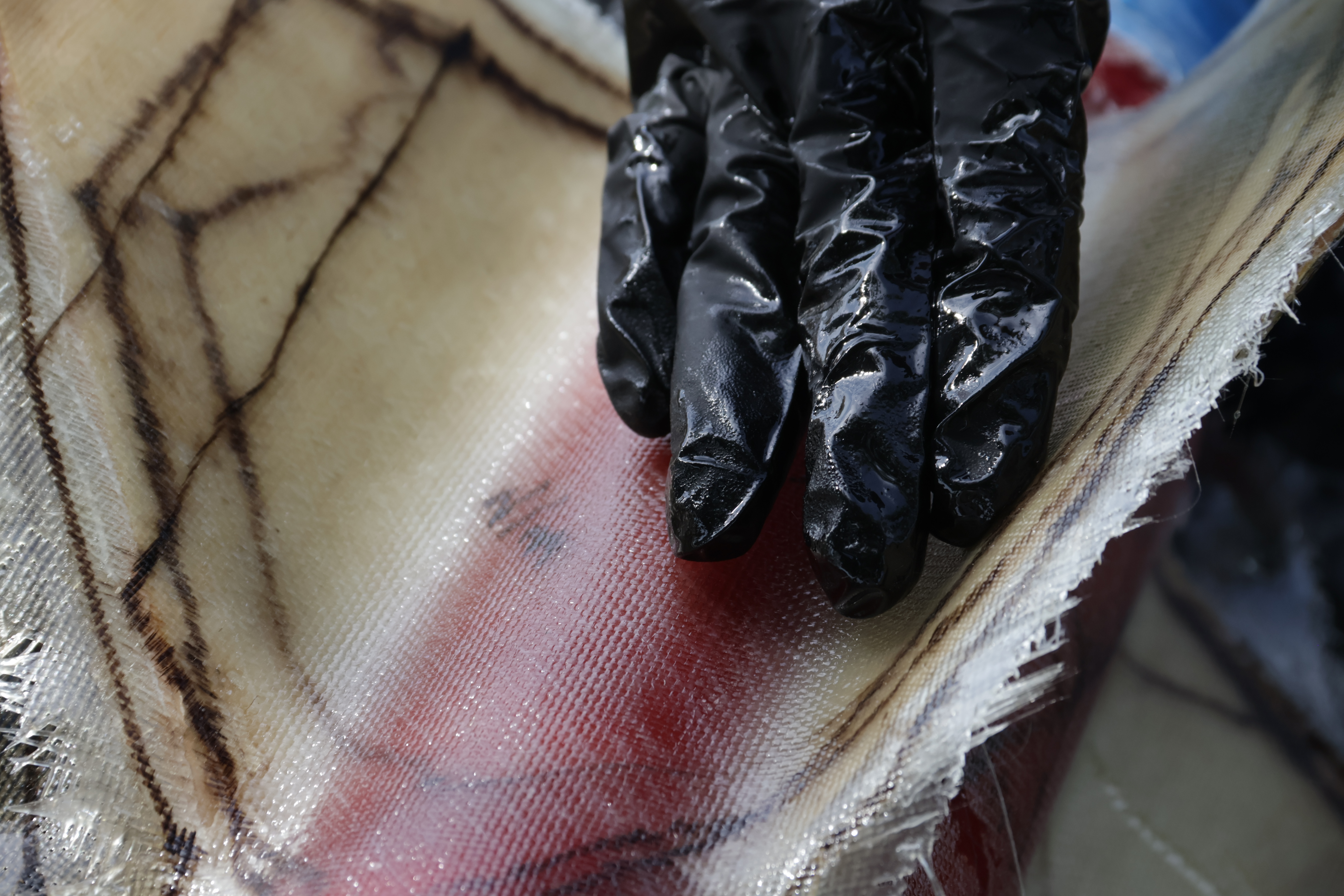 Fiberglass weave layed over a rocket's fins